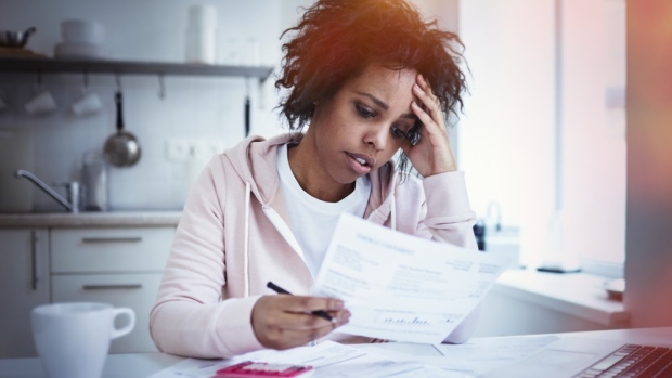 mortage-debt-bills-woman-stress-concern
